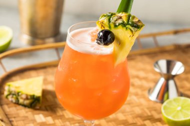 Boozy Cold Rum Runner Cocktail with Cherry and PIneapple