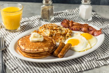 Full Homemade American Pancake Breakfast Brunch with Eggs Bacon and Hashbrowns