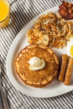 Full Homemade American Pancake Breakfast Brunch with Eggs Bacon and Hashbrowns
