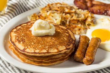 Full Homemade American Pancake Breakfast Brunch with Eggs Bacon and Hashbrowns