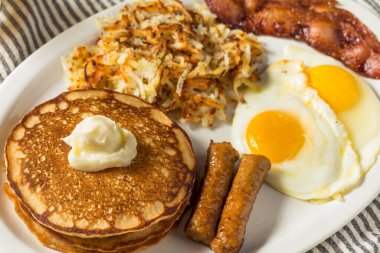 Full Homemade American Pancake Breakfast Brunch with Eggs Bacon and Hashbrowns