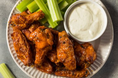 Homemade Spicy Buffalo Chicken Wings with Celery and Blue Cheese