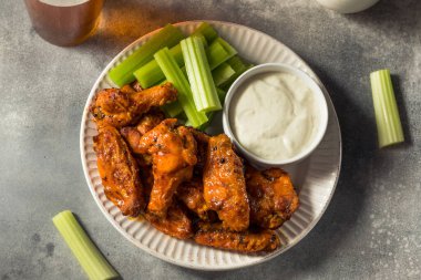 Homemade Spicy Buffalo Chicken Wings with Celery and Blue Cheese