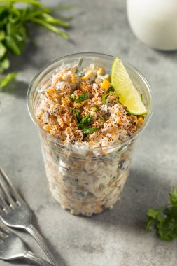 Homemade Corn Elote Esquites in a Cup with Mayo and LIme