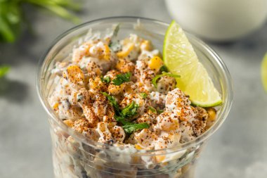 Homemade Corn Elote Esquites in a Cup with Mayo and LIme