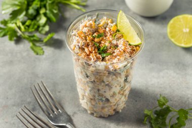 Homemade Corn Elote Esquites in a Cup with Mayo and LIme