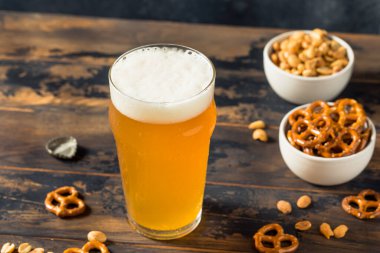 Cold Boozy Refreshing Oktoberfest Beer with Pretzels and Nuts
