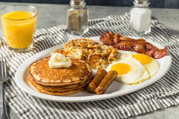Full Homemade American Pancake Breakfast Brunch with Eggs Bacon and Hashbrowns