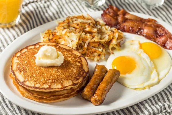 Full Homemade American Pancake Breakfast Brunch with Eggs Bacon and Hashbrowns