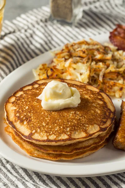 Full Homemade American Pancake Breakfast Brunch with Eggs Bacon and Hashbrowns