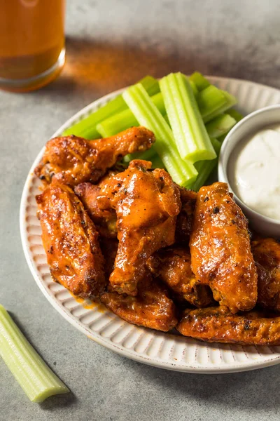 Homemade Spicy Buffalo Chicken Wings with Celery and Blue Cheese