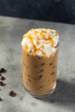 Cold Refreshing Caramel Iced Latte with Whipped Cream