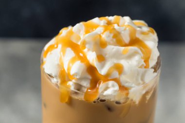 Cold Refreshing Caramel Iced Latte with Whipped Cream