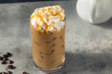Cold Refreshing Caramel Iced Latte with Whipped Cream