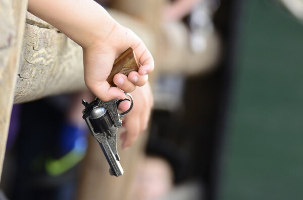 Kid holding a gun