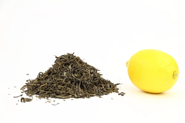 Hojas de té y limón — Foto de Stock