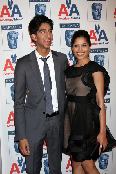 Dev Patel, Freida Pinto — Stockfoto