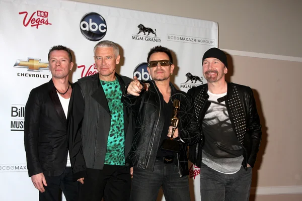U2 (Ларри Маллен-младший, Адам Кларк, Боно и The Edge) ) — стоковое фото
