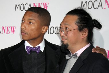 Musician Pharrell Williams (L) and artist Takashi Murakami clipart