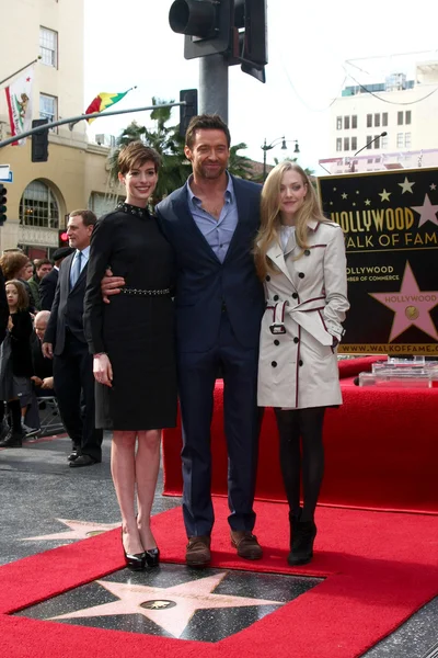 Anne Hathaway, Hugh Jackman, Amanda Seyfried — kuvapankkivalokuva