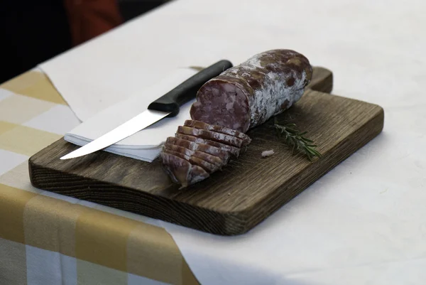 Salami and knife — Stock Photo, Image