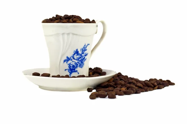Taza de café en granos de café tostados —  Fotos de Stock