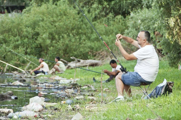 Fishermen fishing on polluted river Danube in Belgrade, Serbia, — Stock Photo, Image