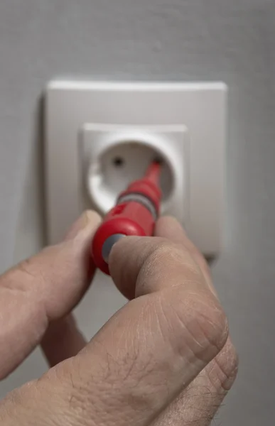 Checking electric voltage on a plug outlet . — Stock Photo, Image