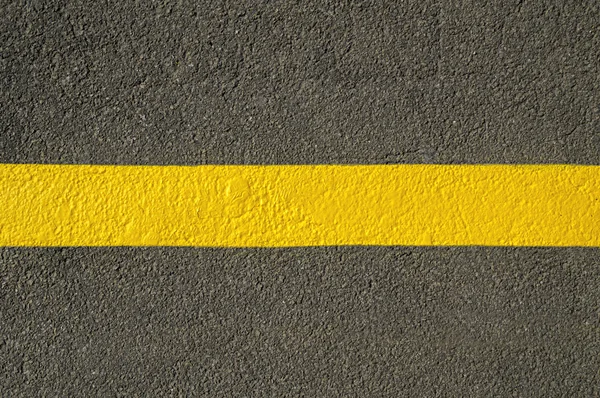 Yellow line on new asphalt detail. — Stock Photo, Image