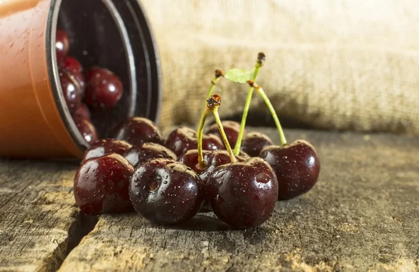 Cherries on wooden table. — Stock Photo, Image