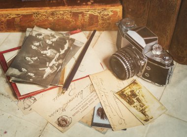 Retro camera, old photos, letters and books with pen composition clipart