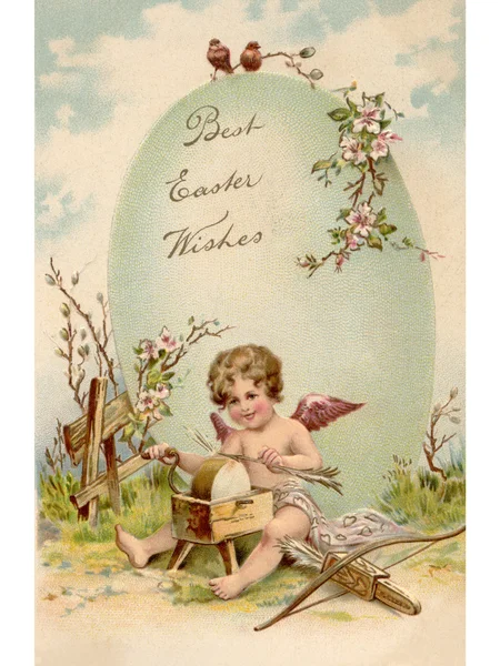 A vintage Easter postcard of a cupid making arrows and a large E — Stock Photo, Image