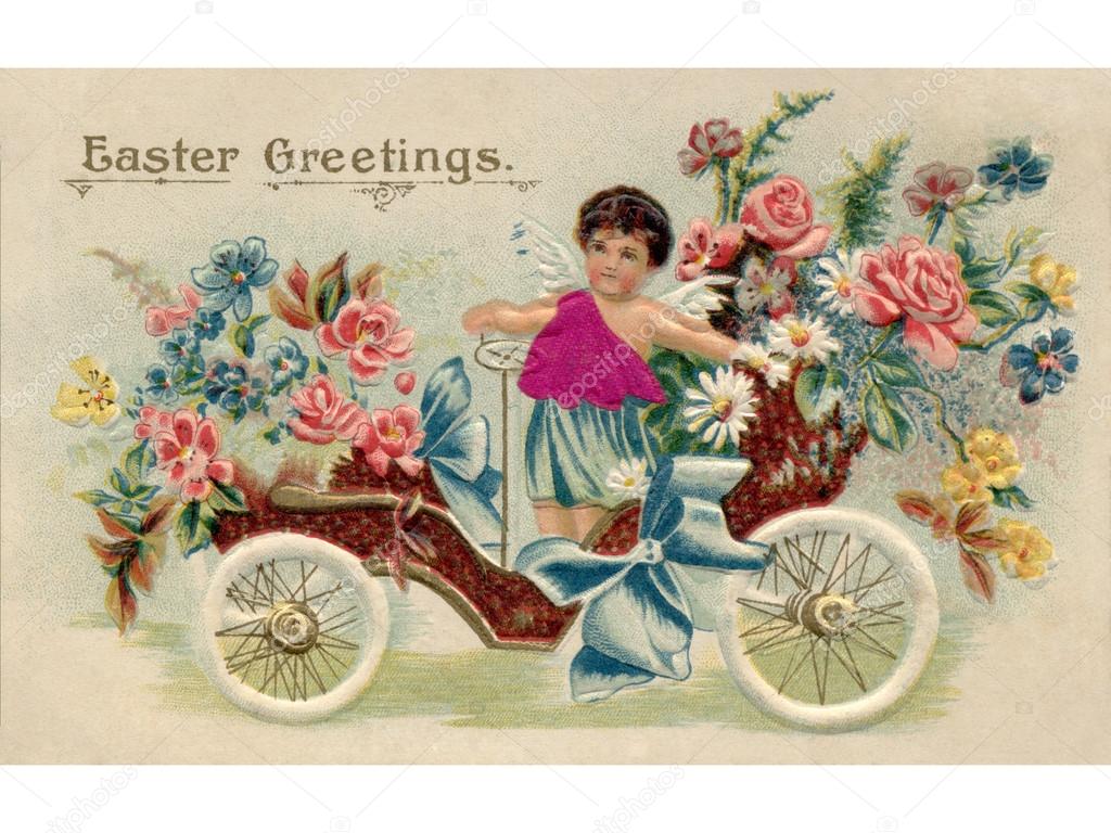A vintage Easter postcard with a cherub riding an antique car fu