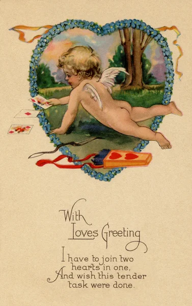 A vintage Valentines postcard with Cupid playing cards next to h — Stock Photo, Image