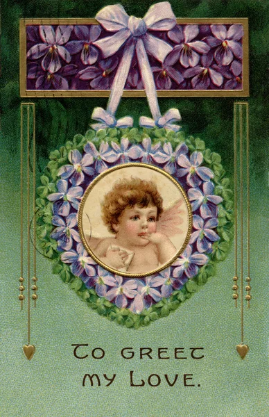 A vintage Valentines postcard with a cherub holding a love lette — Stock Photo, Image