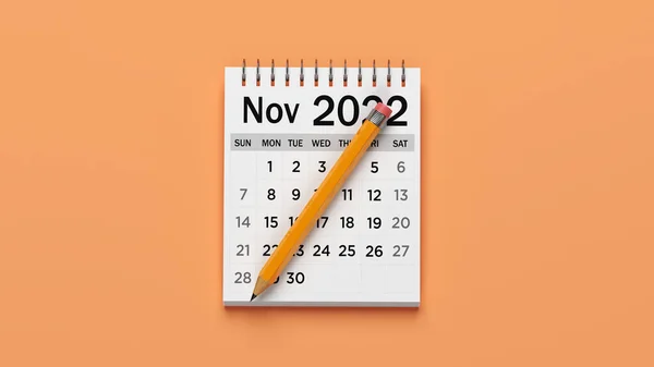 2022年11月のホワイトカラーカレンダー 薄いオレンジ色の背景に コピースペースと水平組成 クリッピングパスで分離 — ストック写真