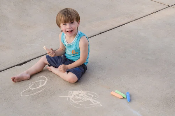 Toddler with sidewalk chalk