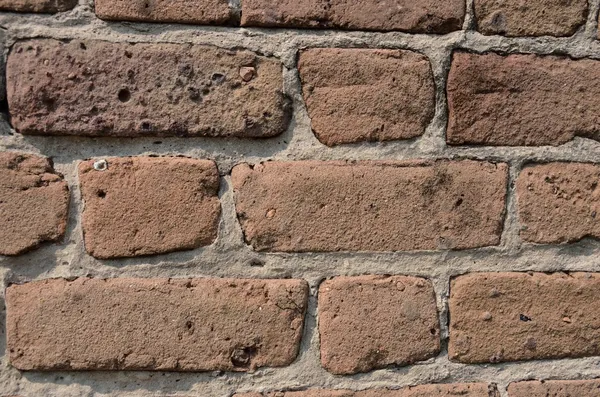 Irregular shaped bricks in mortar — Stock Photo, Image