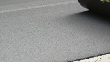 Replacing old asphalt when repairing the road surface. Road rollers level new hot asphalt. Road repair in Europe. Repair and reconstruction of pavement in Europe.