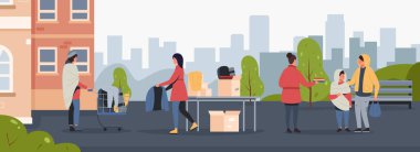 Gönüllü toplum konsepti. Evsizlere ve fakirlere insani yardım sağlayan bir hayır kurumu. Aktivistler, çocuklu kadın ve erkeklere kıyafet veriyor, işsiz vektörlere destek oluyor.