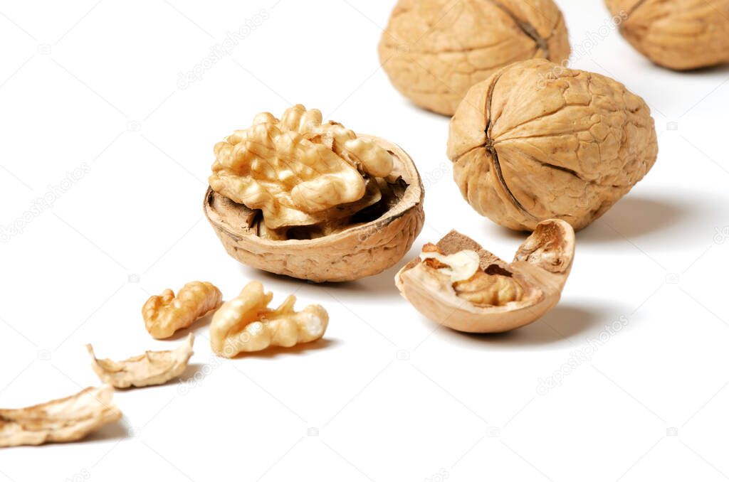 Walnuts and a nutshell on a white background. Nut - a source of vitamins and useful trace elements