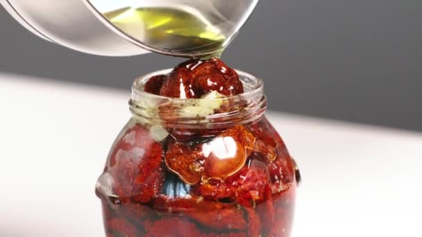 Cook Pours Boiling Olive Oil Glass Jar Sun Dried Tomatoes — Vídeos de Stock