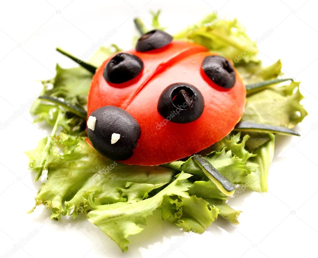 Ladybug made of raw tomato on lettuce leaf — Stock Photo ...
