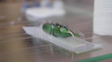 Needle for a tattoo machine and the master prepares a pigment for a tattoo