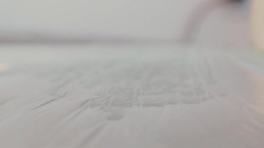 Tattoo artist put the pigment jars on the table in the tattoo parlor