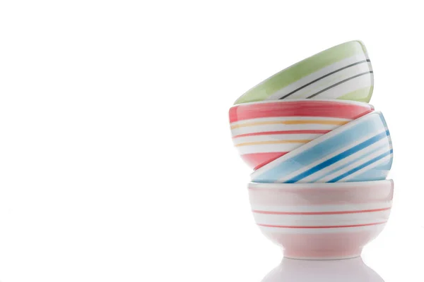 Stack of colorful bowls on white — Stock Photo, Image