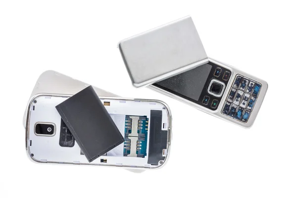 Zerlegtes altes Handy isoliert auf weißem Hintergrund. — Stockfoto