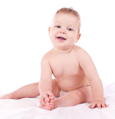 oturma ve ayak tutan erkek bebek portresi