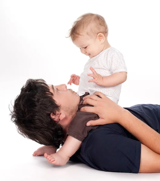 Man playing with his baby on white — Stock Photo, Image