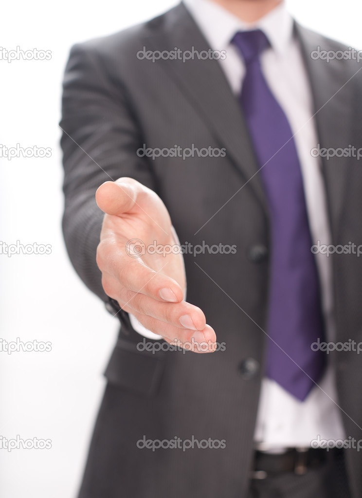 businessman extending open hand to shake against white